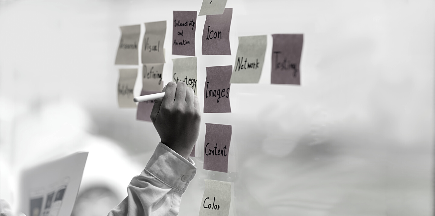 Person Writing on Sticky notes